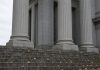 Jay-Z Accuser Recants Rape Allegation as Buzbee’s Lawyers Challenge Her Declaration Granite columns and stone steps of a courthouse on an overcast autumn day, with fallen leaves on the steps