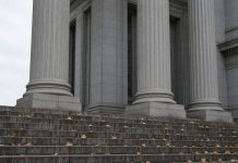 Jay-Z Accuser Recants Rape Allegation as Buzbee’s Lawyers Challenge Her Declaration Granite columns and stone steps of a courthouse on an overcast autumn day, with fallen leaves on the steps