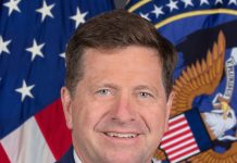 Trump Names Jay Clayton to Lead New Super Intelligence Force on AI Official portrait of Director of National Intelligence Jay Clayton in front of the U.S. flag and ODNI seal