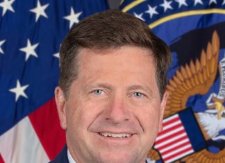Trump Names Jay Clayton to Lead New Super Intelligence Force on AI Official portrait of Director of National Intelligence Jay Clayton in front of the U.S. flag and ODNI seal