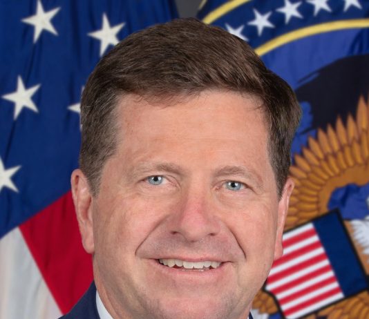 Trump Names Jay Clayton to Lead New Super Intelligence Force on AI Official portrait of Director of National Intelligence Jay Clayton in front of the U.S. flag and ODNI seal
