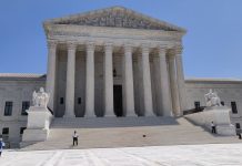 Supreme Court Opens Term With Boulder Climate Suit Against Exxon, Suncor Front view of the U.S. Supreme Court building with Corinthian columns and wide marble stairs