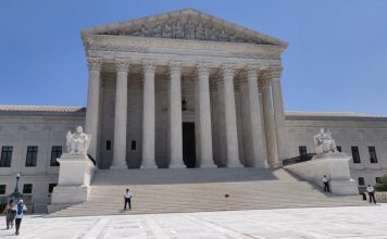 Supreme Court Opens Term With Boulder Climate Suit Against Exxon, Suncor Front view of the U.S. Supreme Court building with Corinthian columns and wide marble stairs