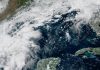 NHC Raises Gulf Development Odds to 80% as Tropical Depression Expected GOES-19 satellite view of clouds over the southwestern Gulf off eastern Mexico, with Texas, Louisiana and Florida coasts