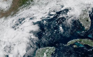 NHC Raises Gulf Development Odds to 80% as Tropical Depression Expected GOES-19 satellite view of clouds over the southwestern Gulf off eastern Mexico, with Texas, Louisiana and Florida coasts