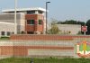 Trump Approves Firing Squad Execution for Fort Hood Shooter Nidal Hasan Entrance sign and main building of the U.S. Disciplinary Barracks at Fort Leavenworth, Kansas