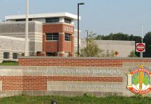 Trump Approves Firing Squad Execution for Fort Hood Shooter Nidal Hasan Entrance sign and main building of the U.S. Disciplinary Barracks at Fort Leavenworth, Kansas