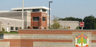 Trump Approves Firing Squad Execution for Fort Hood Shooter Nidal Hasan Entrance sign and main building of the U.S. Disciplinary Barracks at Fort Leavenworth, Kansas