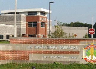 Trump Approves Firing Squad Execution for Fort Hood Shooter Nidal Hasan Entrance sign and main building of the U.S. Disciplinary Barracks at Fort Leavenworth, Kansas