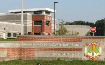 Trump Approves Firing Squad Execution for Fort Hood Shooter Nidal Hasan Entrance sign and main building of the U.S. Disciplinary Barracks at Fort Leavenworth, Kansas