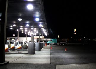 Trump Opens Red-Dyed Diesel to Highways, Defers Federal Tax Through Dec. 31 Diesel pumps under a lit canopy at a Flying J truck stop at night, with a semi-truck parked nearby