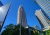 Bank of America Q3 Profit Falls 17% After $1.2 Billion Treasury Fine Bank of America Corporate Center tower rising above neighboring skyscrapers in uptown Charlotte, North Carolina